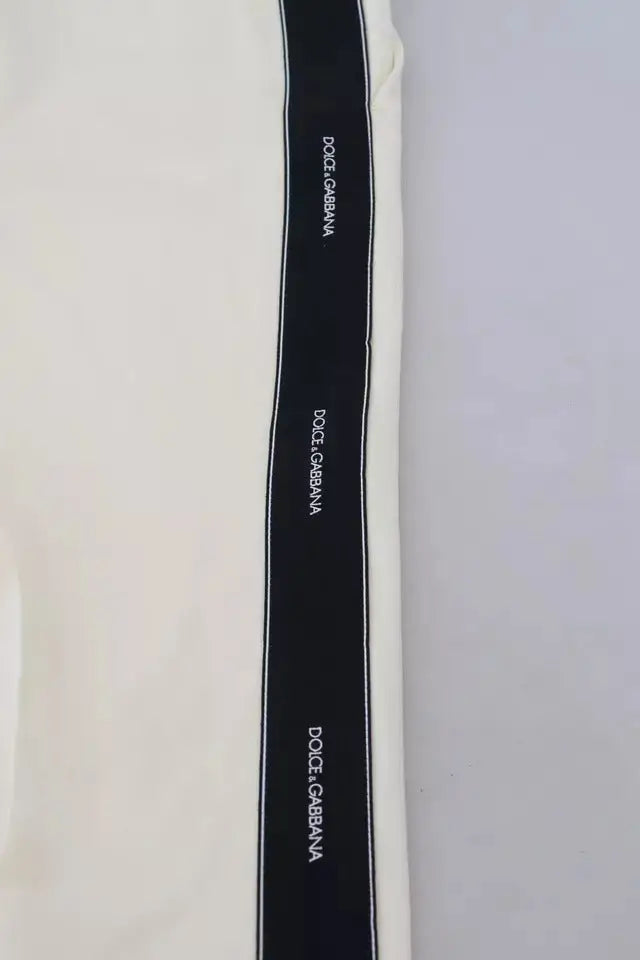 Ruban noir avec logo blanc dolce gabbana cousu sur bord crème pantalon blanc taille haute en laine tapered