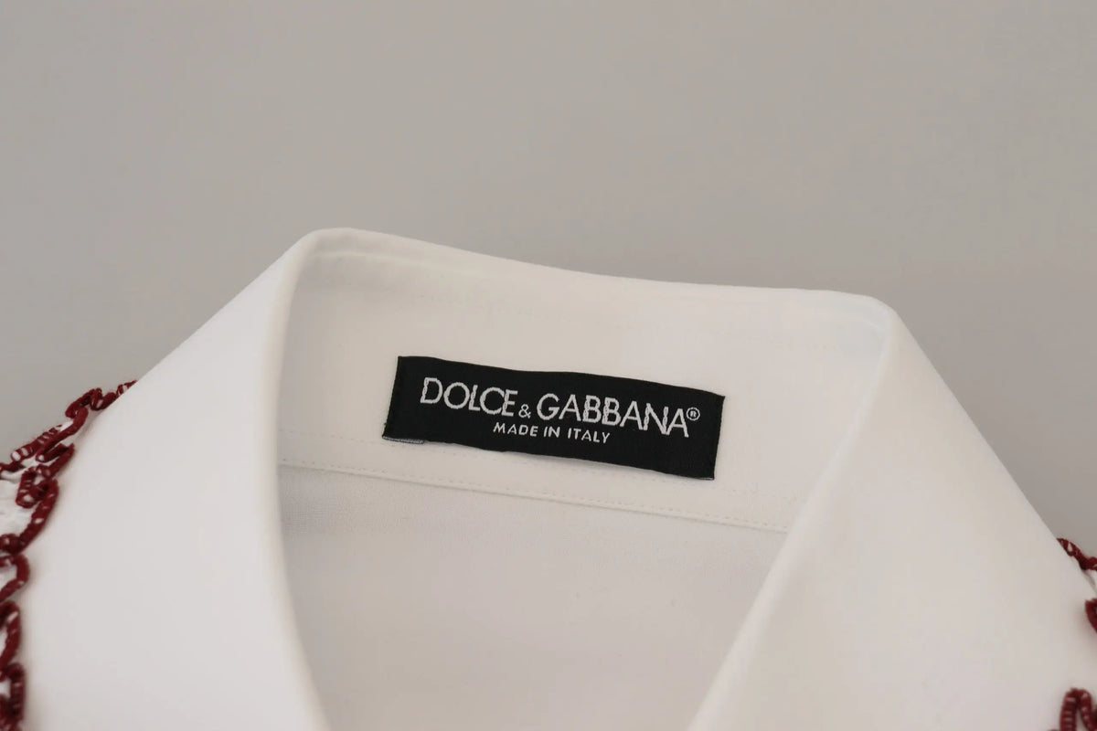 Blouse dolce gabbana blanche en dentelle à manches longues avec col à volants et détails perlés rouges