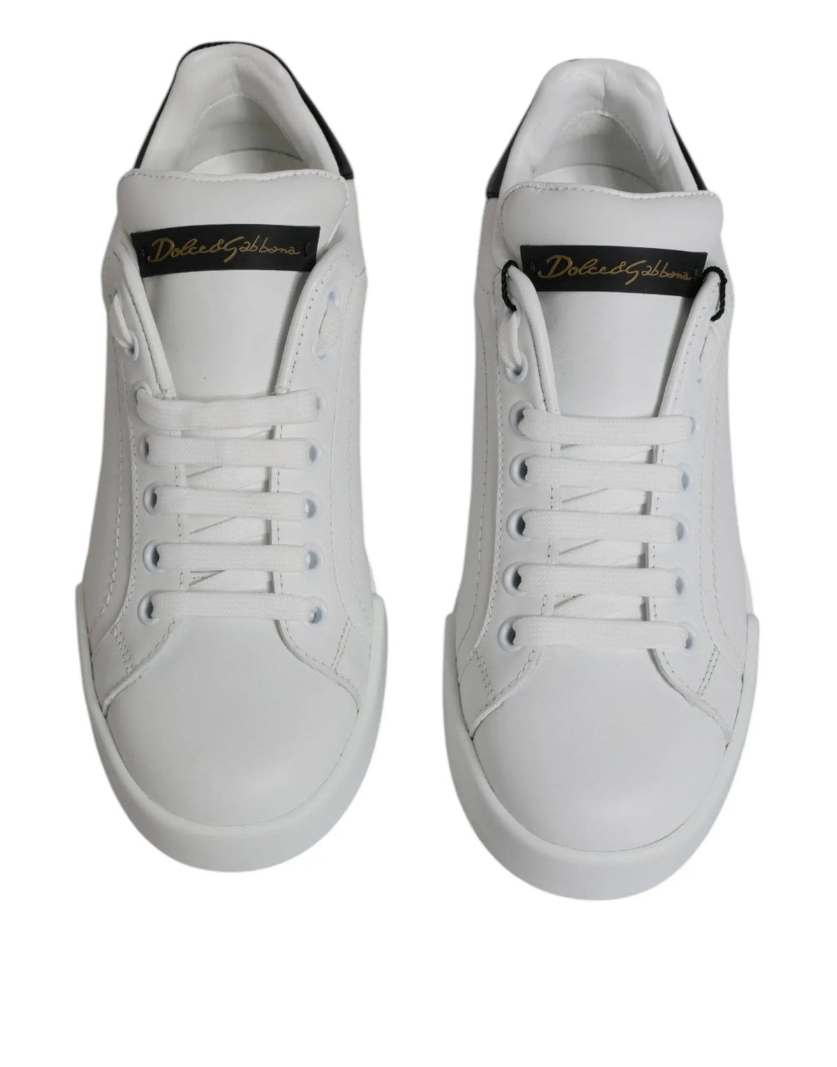 Baskets basses blanches en cuir dolce & gabbana avec accents noirs et logo doré sur la languette