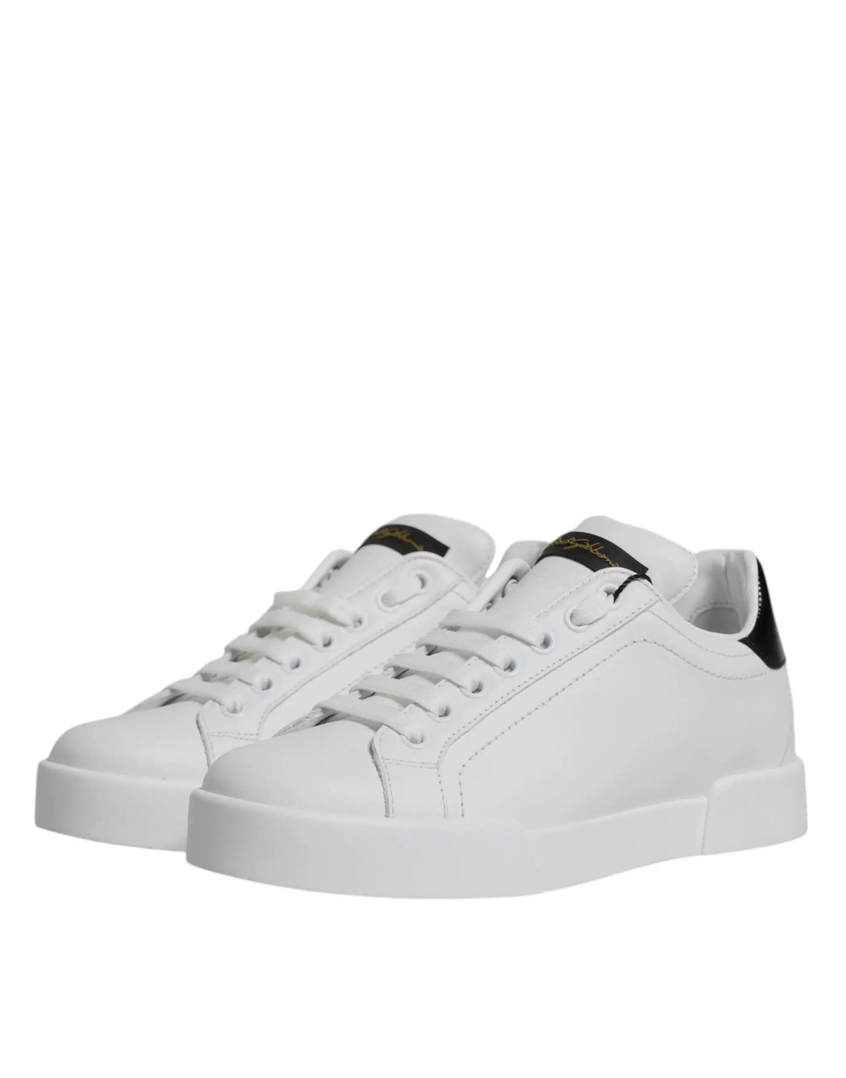 Baskets basses classiques dolce & gabbana en cuir blanc avec accents noirs au talon et à la languette