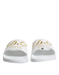 Sandales slides dolce & gabbana blanches en cuir avec lettrage doré et motifs étoiles luxury hotel pour la plage