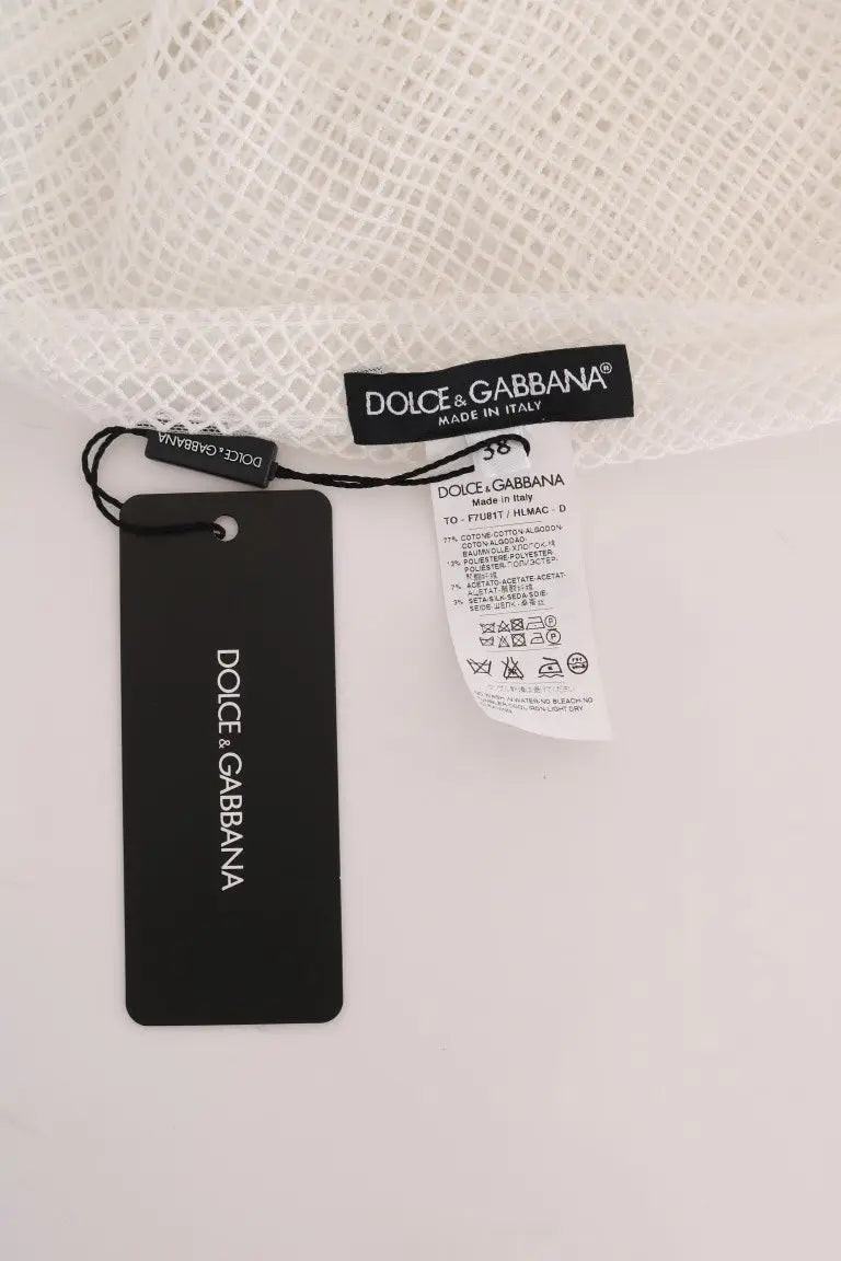 Étiquette noire dolce & gabbana avec logo blanc et instructions d entretien d un débardeur transparent en maille blanche