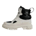 Dolce & gabbana bottes montantes blanches et noires en cuir verni à semelle épaisse avec lacets et rembourrage midi mollet