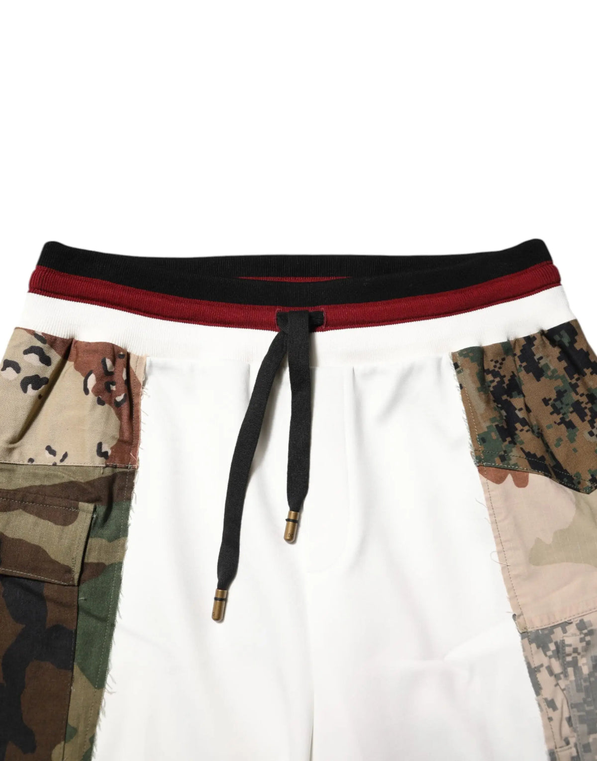 Dolce & gabbana white patchwork jogger pants with camouflage panels, black drawstring waistband, and brass aglets