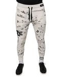 Pantalon jogging dolce gabbana blanc en coton avec imprimé lettres dg et dolce gabbana noir sur le tissu