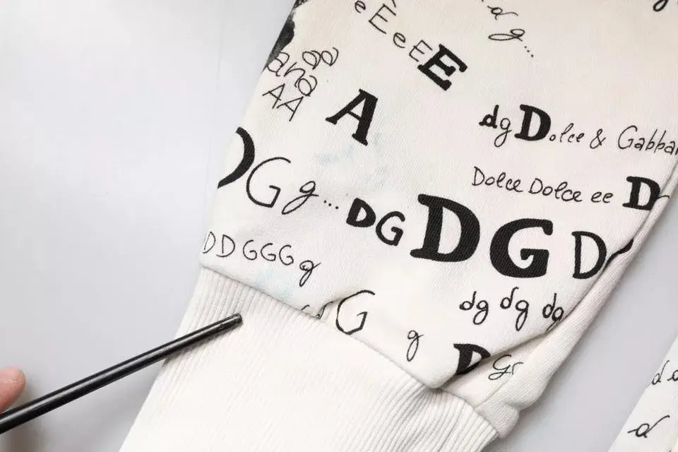 Pantalon de jogging blanc en coton dolce gabbana avec imprimé typographique noir dg sur le devant
