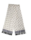 Foulard en soie crème dolce & gabbana avec motifs crânes noirs, bandes satin grises et franges noires, 183cm x 33cm
