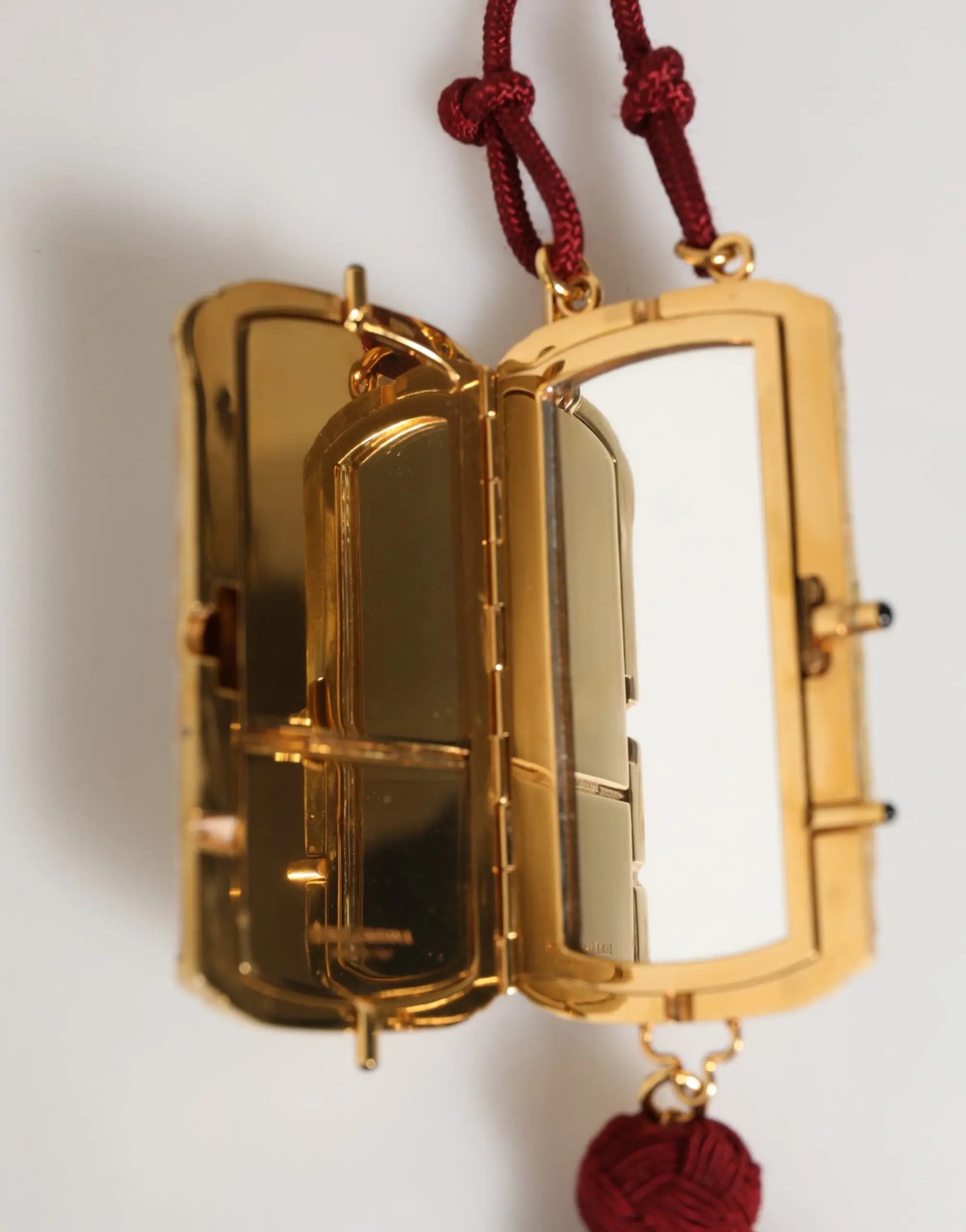 Miroir compact rectangulaire doré avec cordon tressé rouge suspendu pour sac mini pochette croisée dolce & gabbana