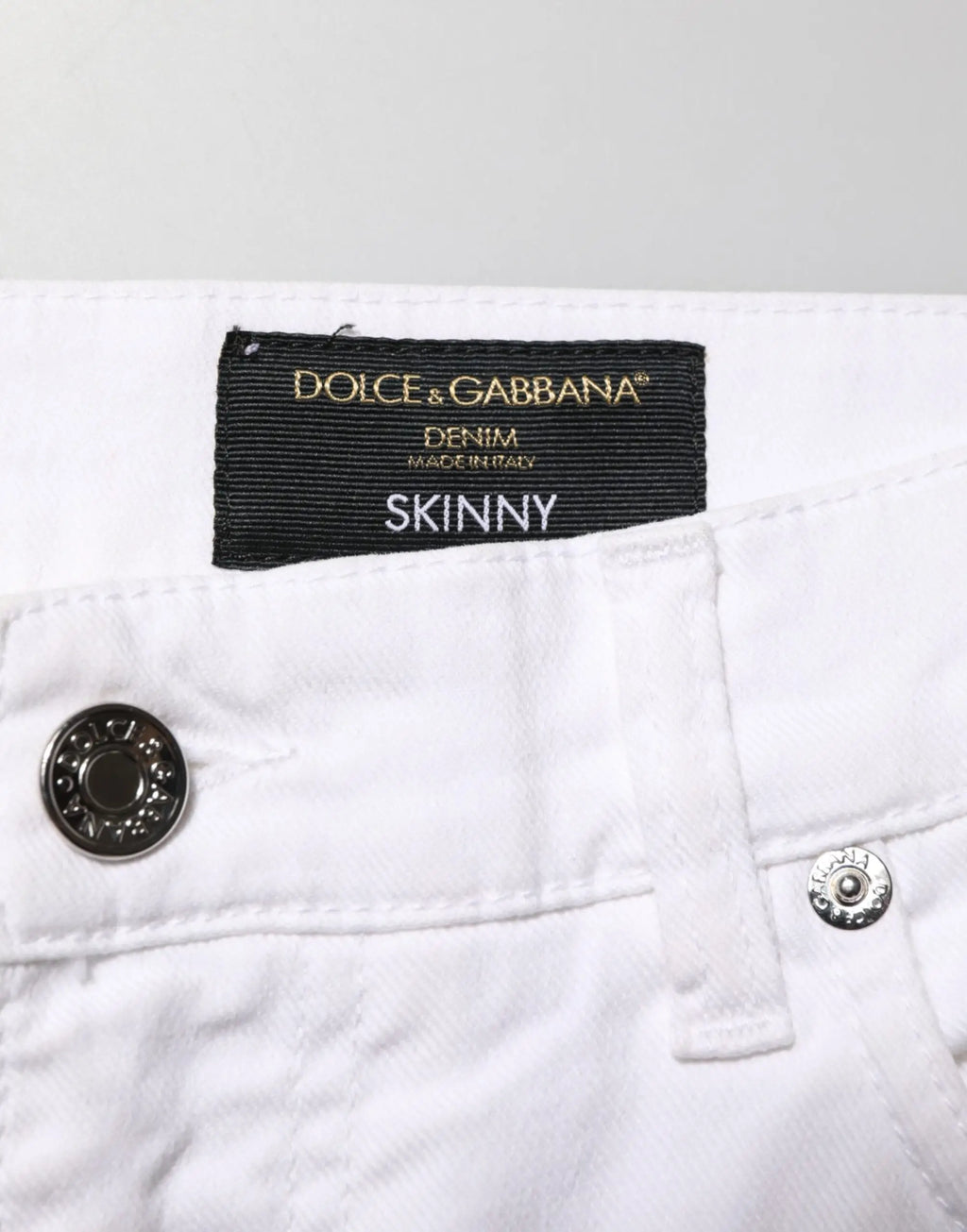 Jeans slim en denim blanc avec déchirures pour homme en coton dolce & gabbana avec étiquette noire visible