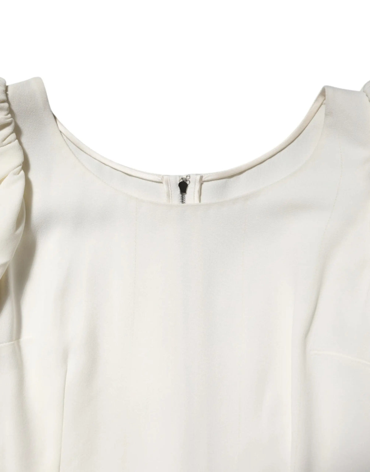 Blouse dolce & gabbana blanche encolure ronde manches courtes avec épaules à volants et fermeture zippée centrale