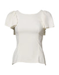 Blouse dolce & gabbana blanche en coton avec manches courtes volantées et bas peplum élégant