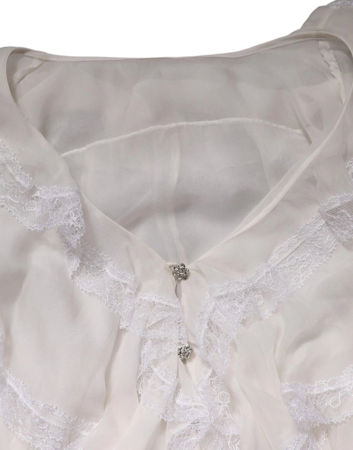 Blouse blanche dolce & gabbana à manches longues en dentelle avec volants et boutons en cristal raffinés