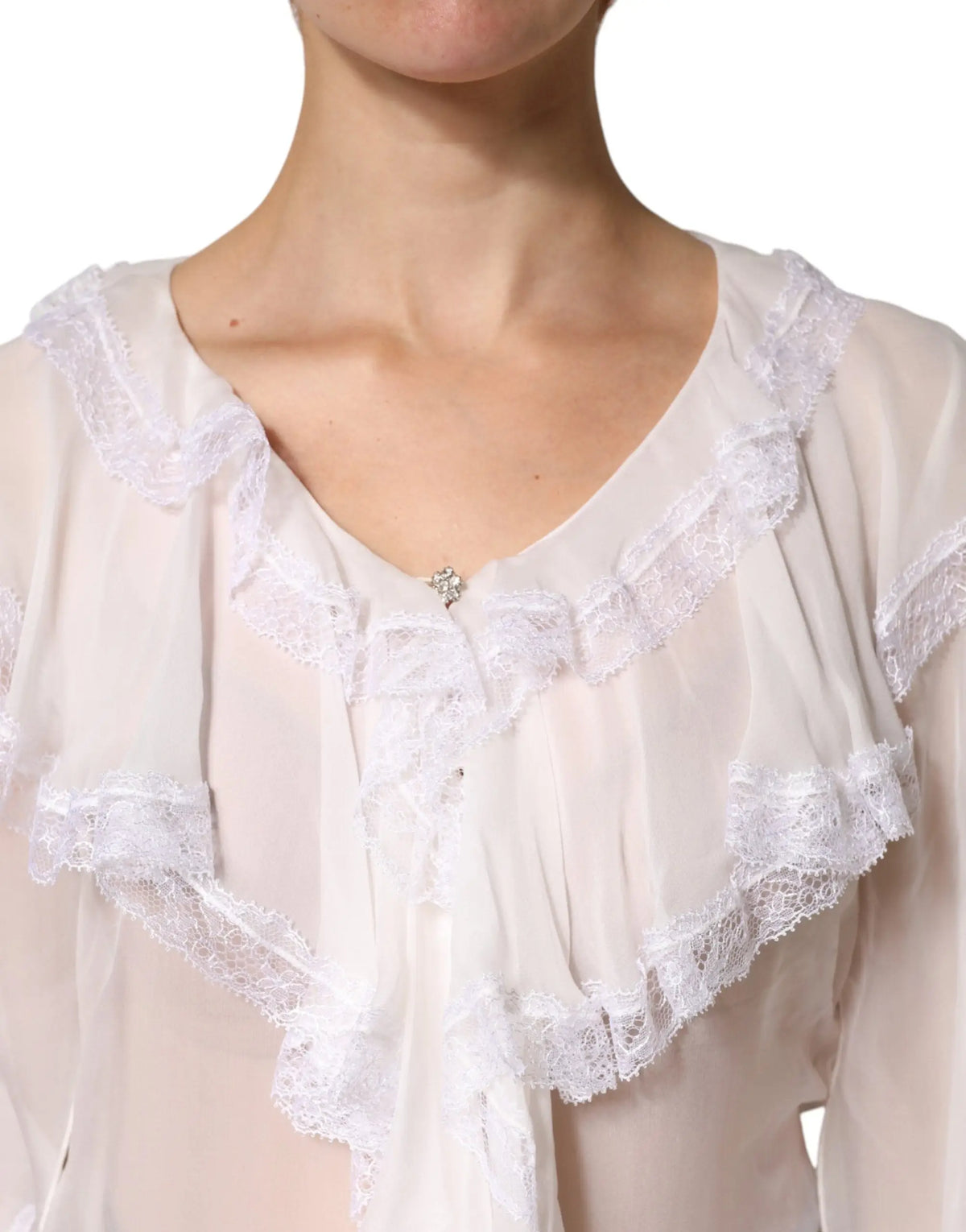 Blouse longue à manches longues dolce & gabbana blanche en dentelle délicate avec col volanté élégant en tissu léger et fluide