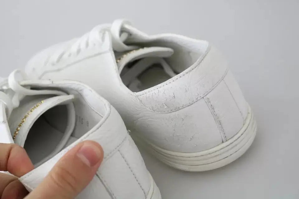 Baskets homme dolce & gabbana saint tropez en cuir blanc à lacets avec usure visible sur le bout et le talon