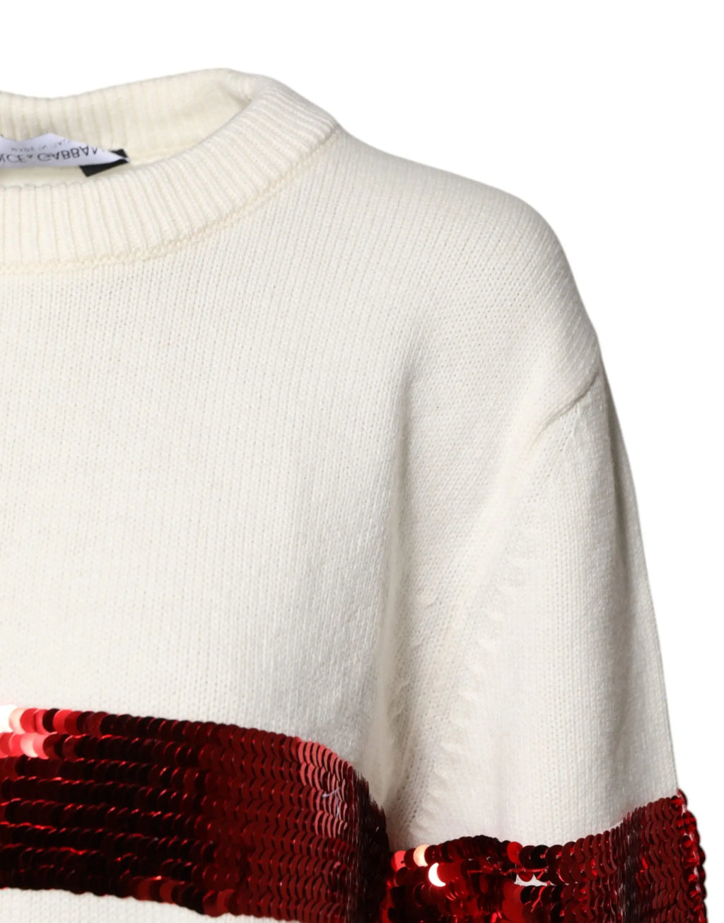 Pull tricoté crème dolce & gabbana avec large bande horizontale de sequins rouges au niveau de la poitrine et manche