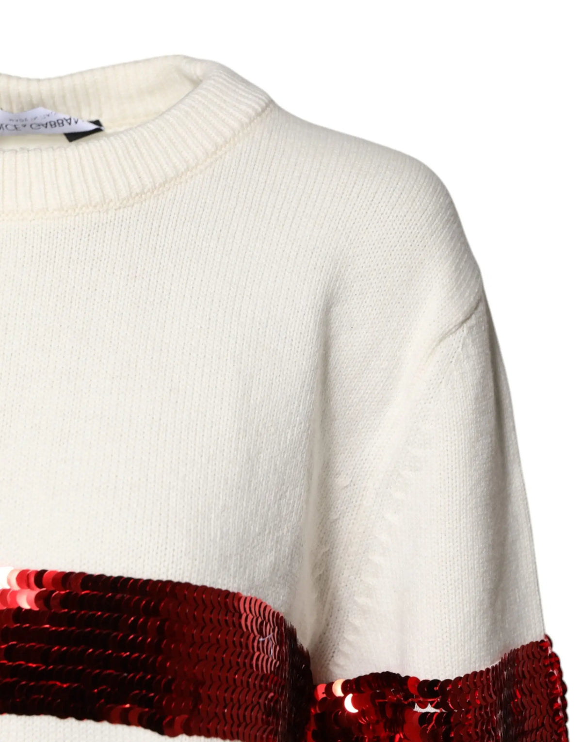 Pull tricoté crème dolce & gabbana avec large bande horizontale de sequins rouges au niveau de la poitrine et manche
