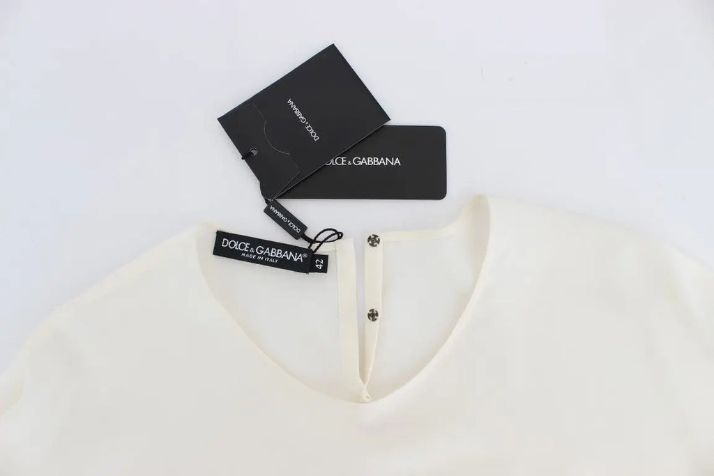 Blouse dolce & gabbana en soie blanche avec sequins et boutons subtils au col couleur crème fluide