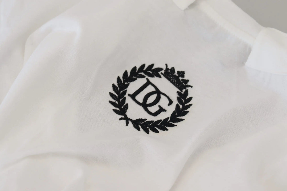 Polo blanc en coton dolce gabbana avec logo noir brodé dc entrelacé entouré de couronnes de laurier sur le devant