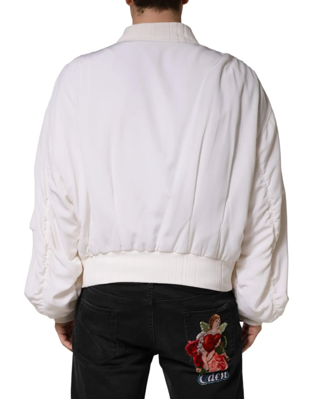 Veste bomber blanche en soie dolce & gabbana avec manches bouffantes et dos matelassé brodé d’un ange tenant des roses