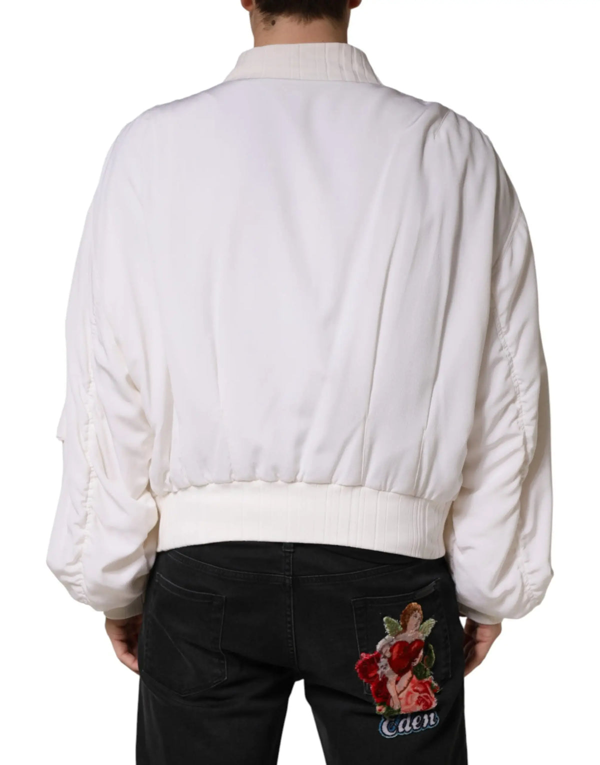 Veste bomber blanche en soie dolce & gabbana avec manches bouffantes et dos matelassé brodé d’un ange tenant des roses