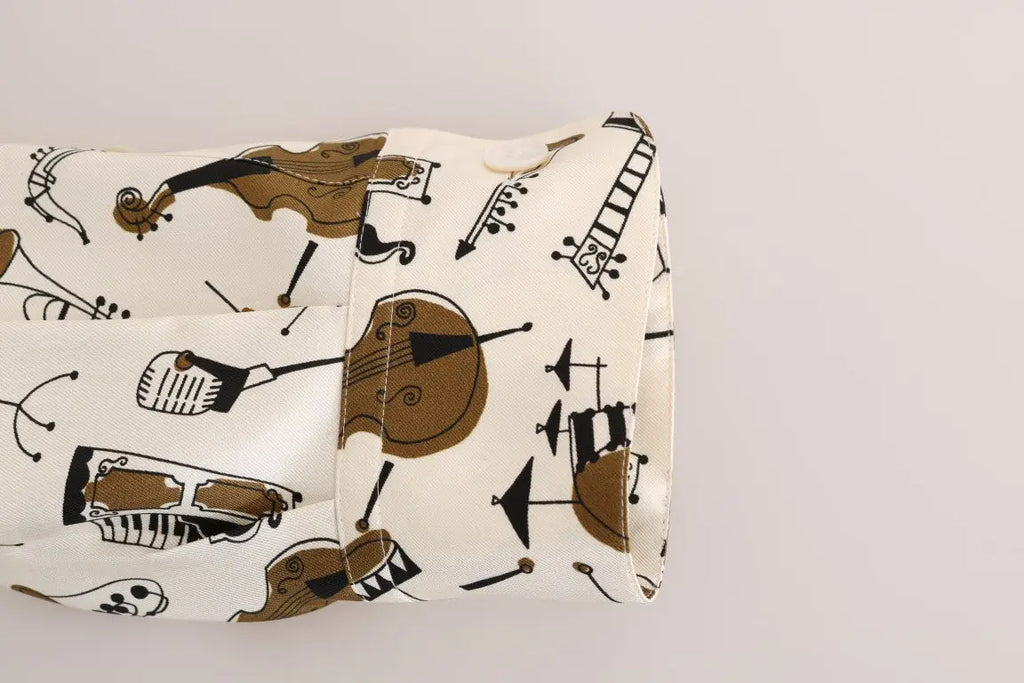 Manche en tissu crème avec motif ludique d instruments de musique marron et noir sur chemise en soie dolce & gabbana