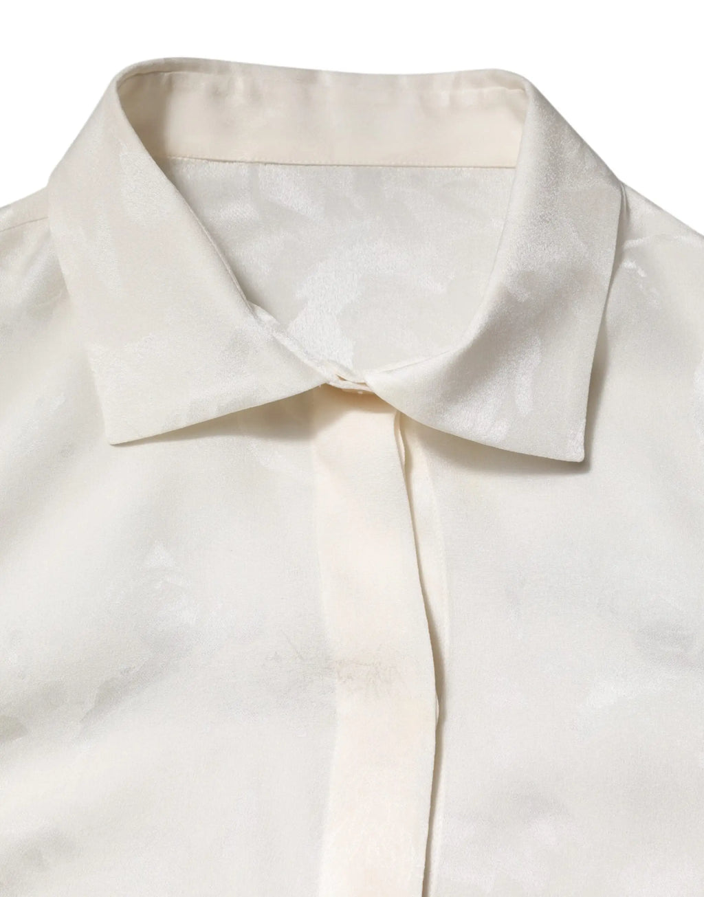 Une blouse blanche en satin doux avec un col pointu classique par dolce & gabbana manches longues en soie