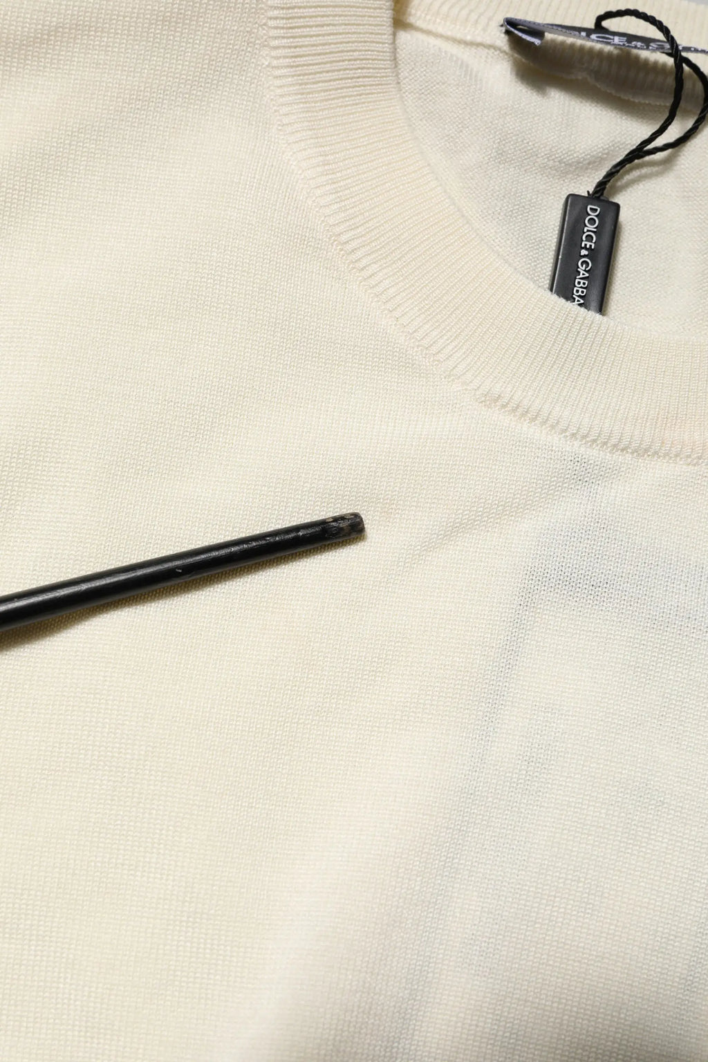 Pull blanc dolce & gabbana en soie à manches courtes avec col côtelé et étiquette noire visible