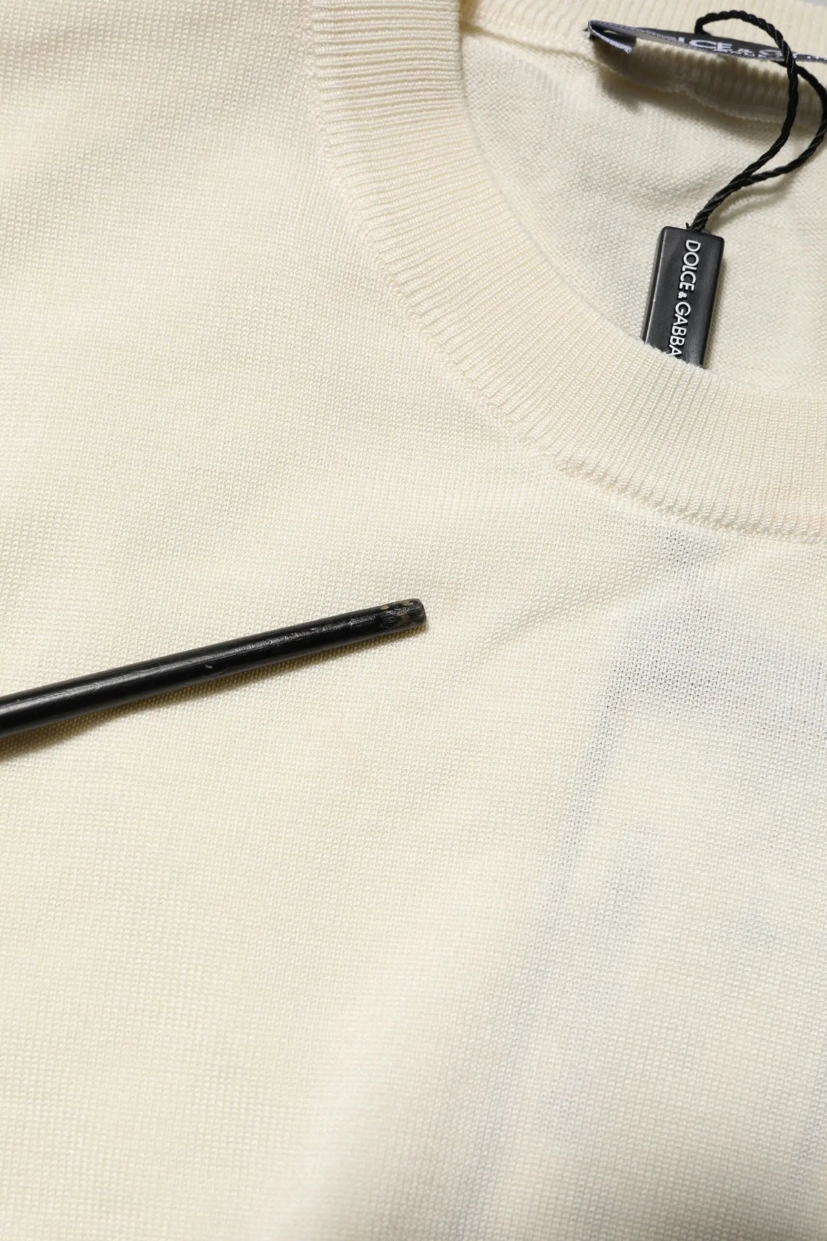 Pull blanc dolce & gabbana en soie à manches courtes avec col côtelé et étiquette noire visible