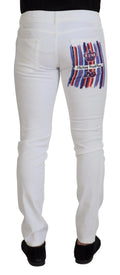 Jeans slim skinny en denim coton blanc dolce & gabbana vue arrière avec graphique rayé rouge blanc bleu et emblème couronne