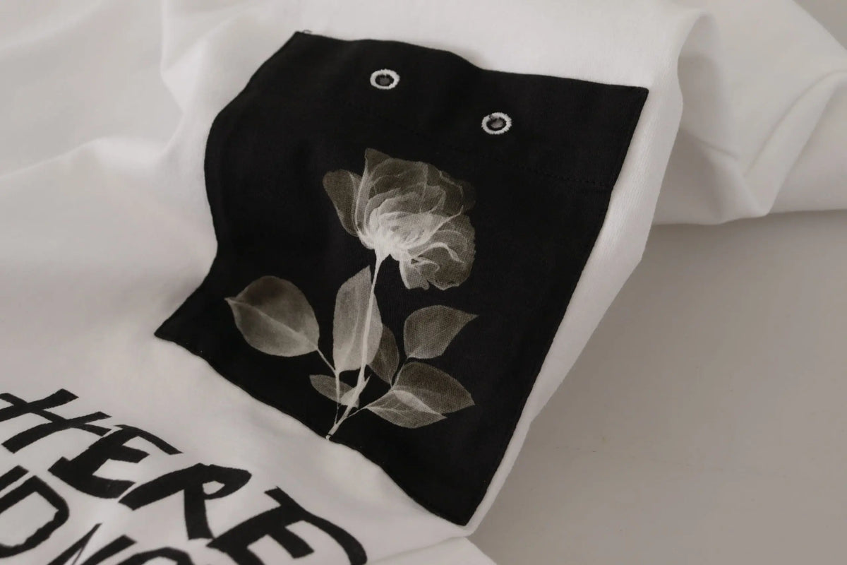 T-shirt en coton noir dolce & gabbana avec imprimé rose blanche, feuille et détails circulaires ressemblant à des yeux