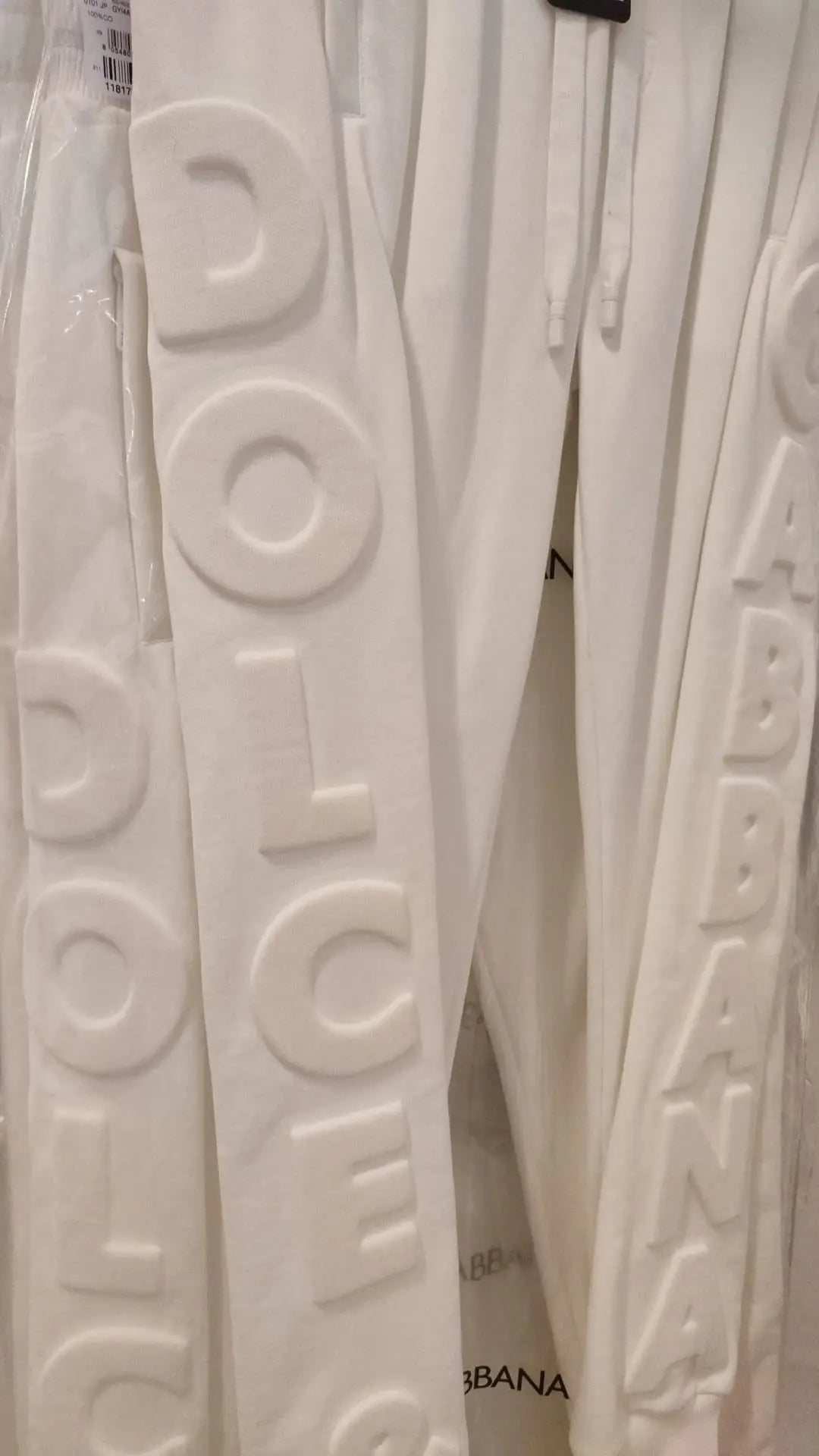Pantalon de survêtement blanc dolce & gabbana en coton avec lettrage embossé sur le côté sport