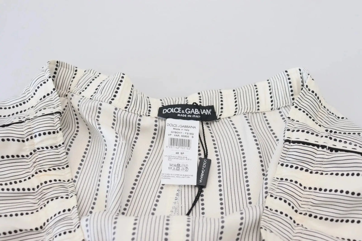Pantalon de détente en soie dolce & gabbana blanc à rayures noires verticales avec lignes en pointillés et étiquette visible