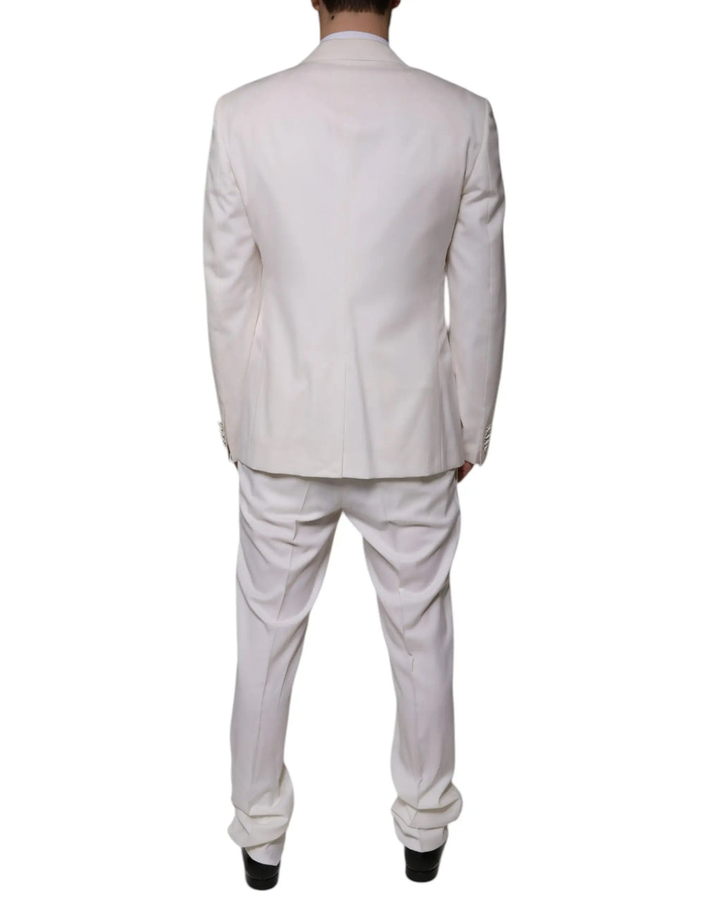 Un costume trois pièces slim fit blanc dolce gabbana en laine et soie avec une coupe classique et une texture subtile