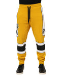 Joggers dolce & gabbana jaunes en coton avec rayures noires blanches et design sportif audacieux sur les jambes