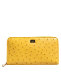 Dolce & gabbana portefeuille continental zippé en cuir d’autruche jaune vif avec plaque métallique et fermeture éclair transparente