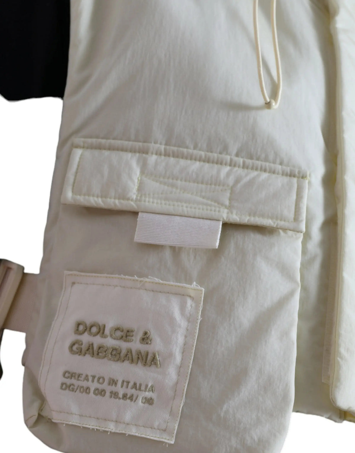 Veston de sport dolce et gabbana jaune en nylon avec capuche et gilet matelassé crème avec étiquette visible
