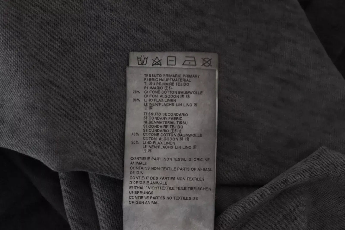 Étiquette d’entretien en tissu blanc avec texte noir indiquant la composition du pull dsquared² noir en coton lin à manches longues