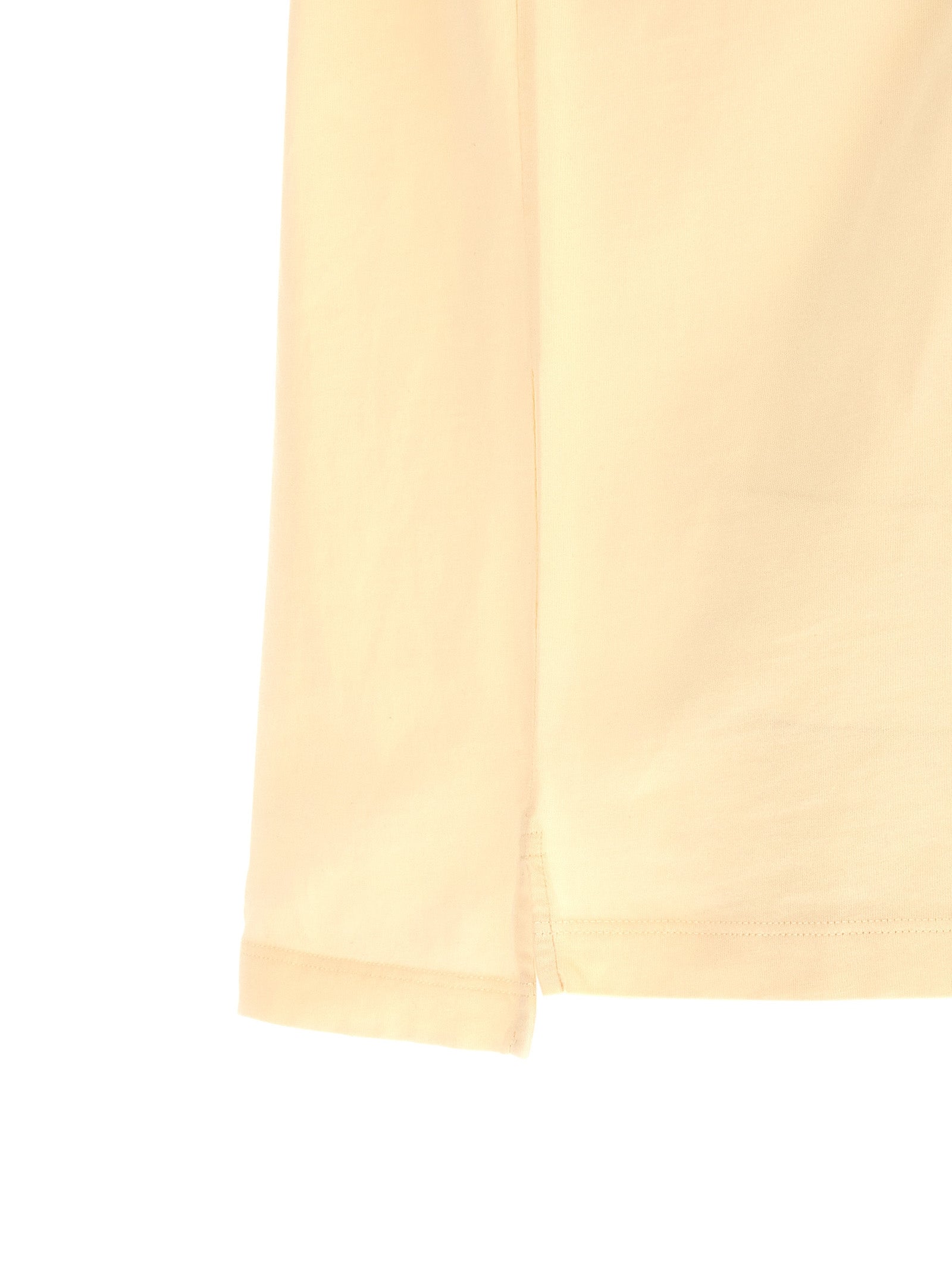 T-shirt en coton beige de la marque Dsquared², coupe classique, porté sur un mannequin.
