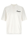 Chemise polo blanche en coton de la marque Dsquared², avec col classique et logo discret visible sur l'image.