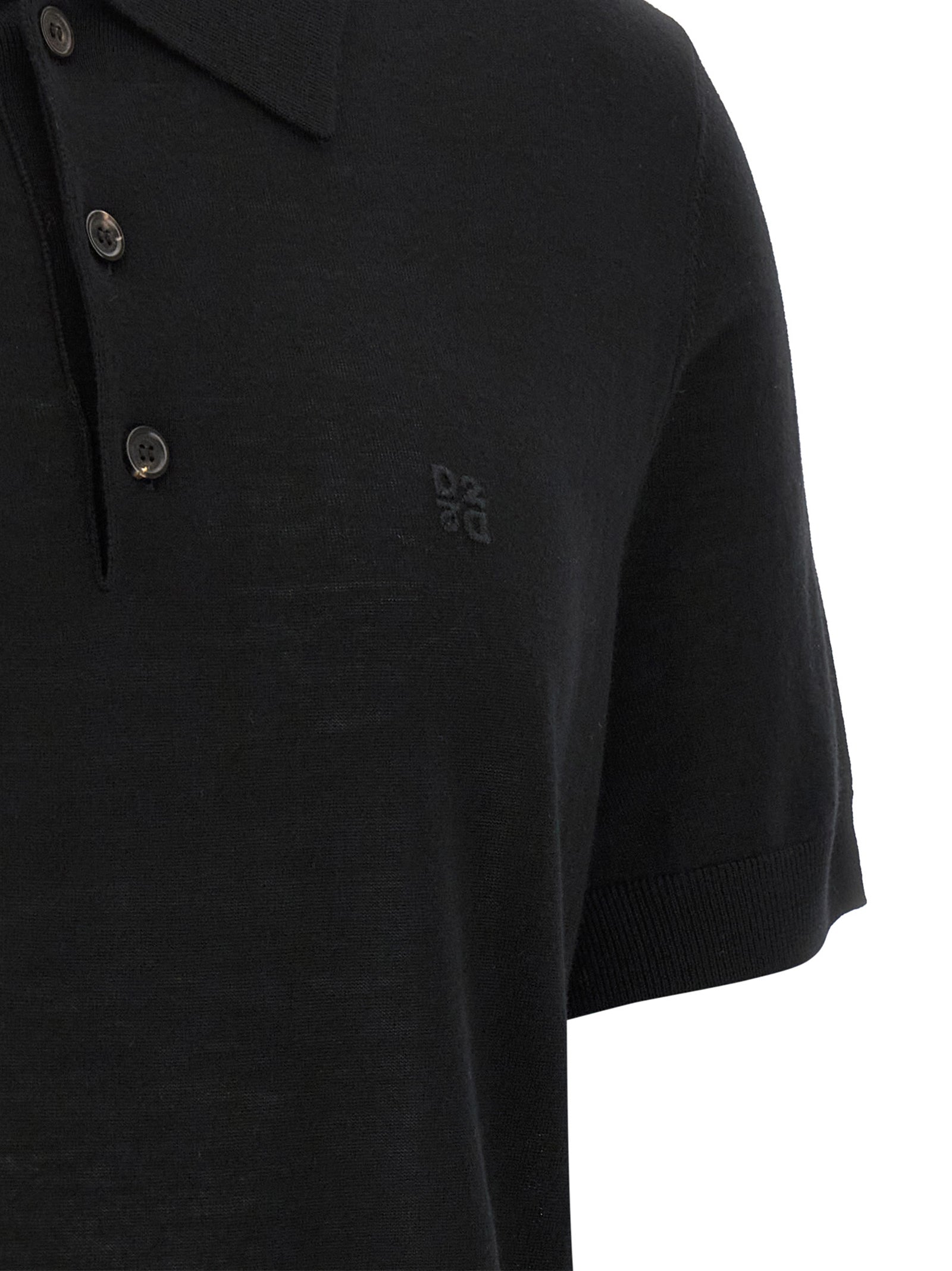 Chemise polo en laine noire Dsquared² avec col classique et logo brodé, portée sur un mannequin.