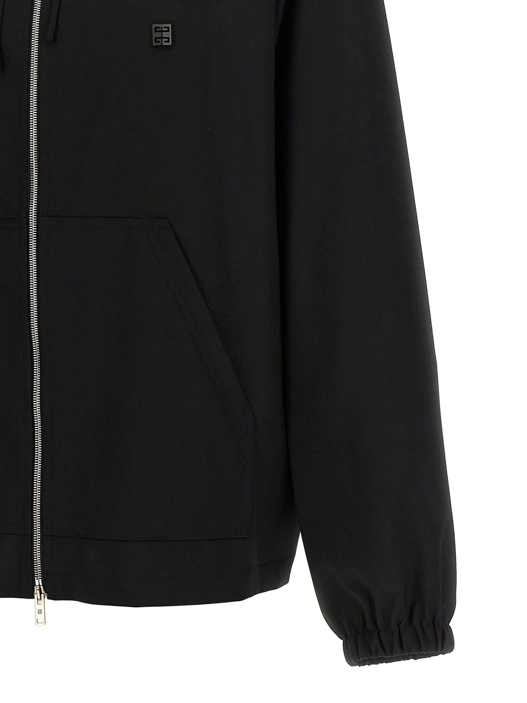 Givenchy sweat noir en laine vierge avec fermeture éclair argentée et patch logo subtil sur la poitrine