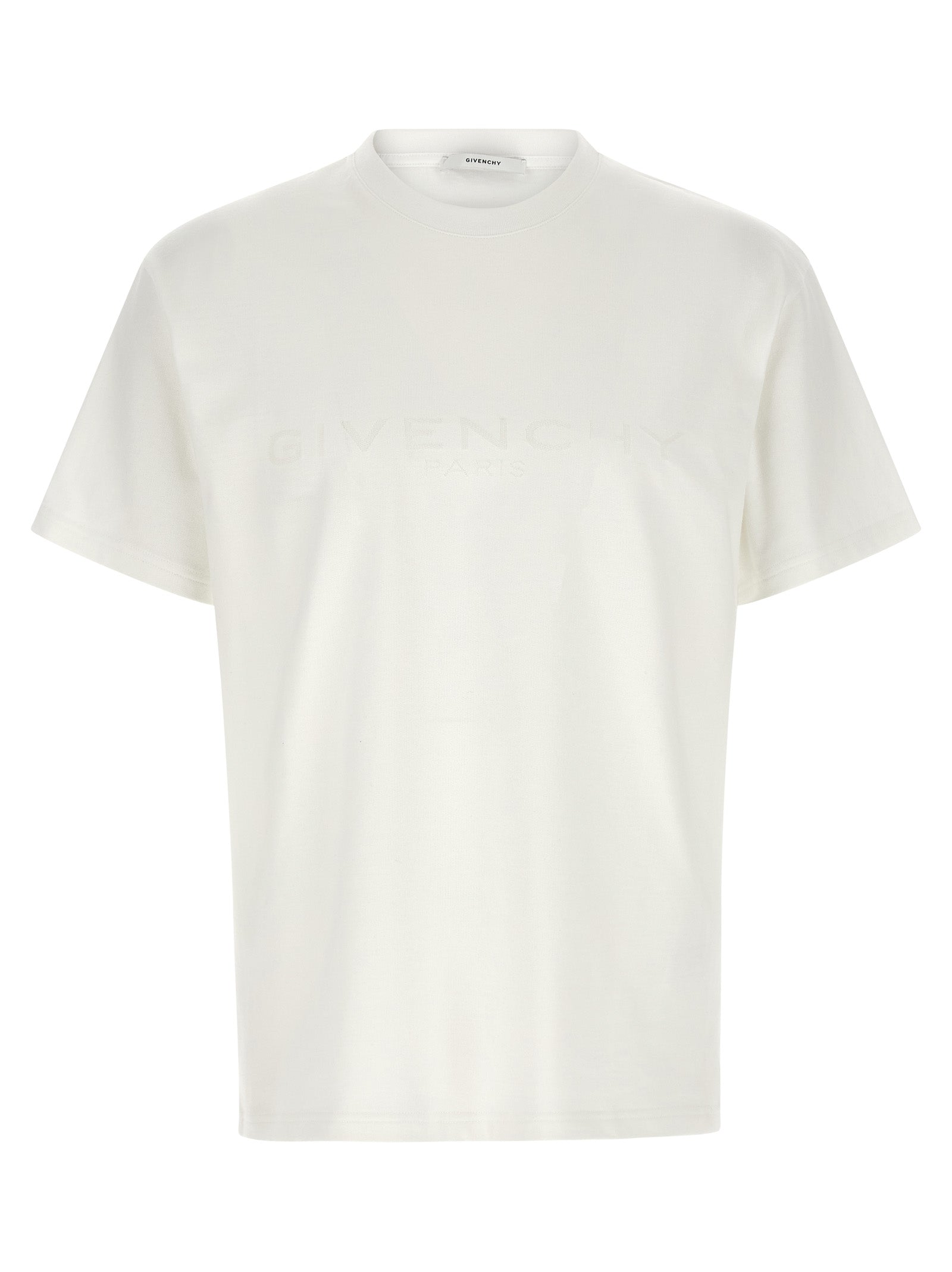 T-shirt blanc en coton Givenchy, vêtement décontracté avec logo subtil, porté sur mannequin.