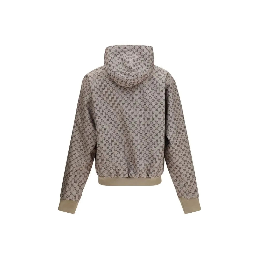 Veste gucci noire en polyester avec capuche beige affichant un motif monogramme répétitif