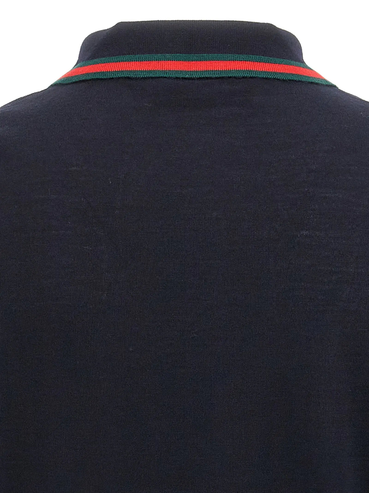 Polo en laine bleu nuit gucci avec col côtelé orné de la bande rouge et verte signature de la marque