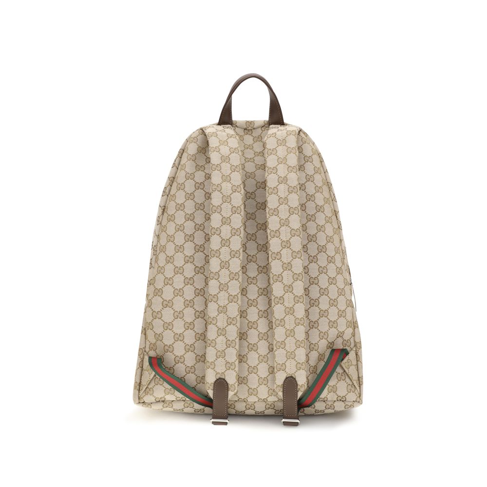 Sac à dos en polyester beige de Gucci, avec logo emblématique et détails élégants, idéal pour un style chic et pratique.