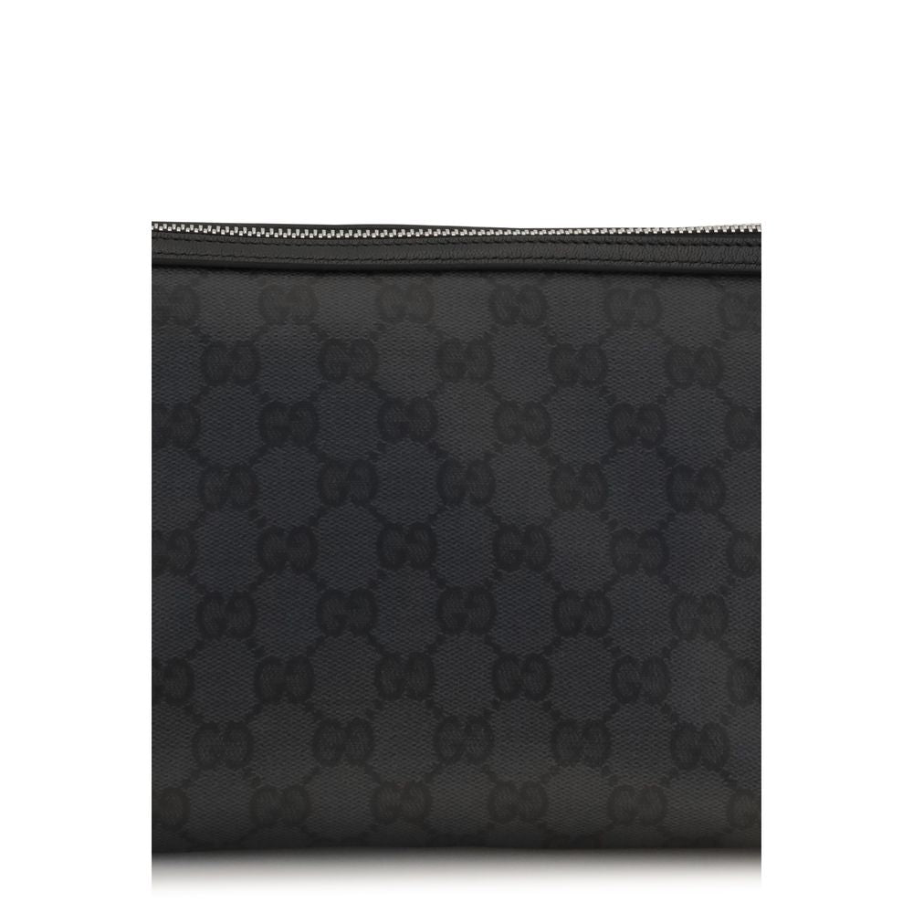 Pochette en coton noir Gucci, sac à main élégant avec logo Gucci visible, idéal pour une tenue sophistiquée.