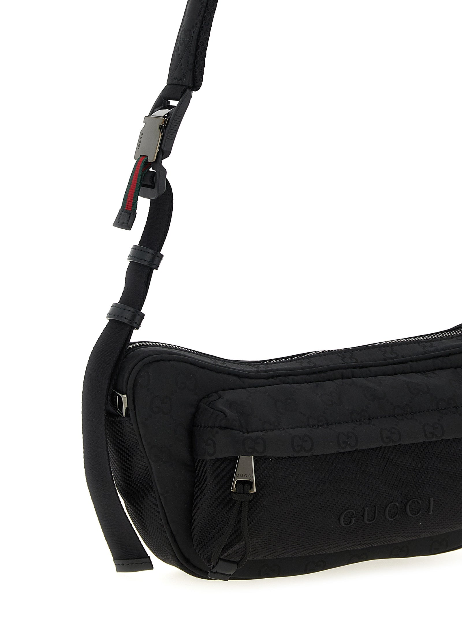 Sac banane Gucci en polyester noir, style croisé, avec logo distinctif et détails élégants, idéal pour un look moderne et pratique.