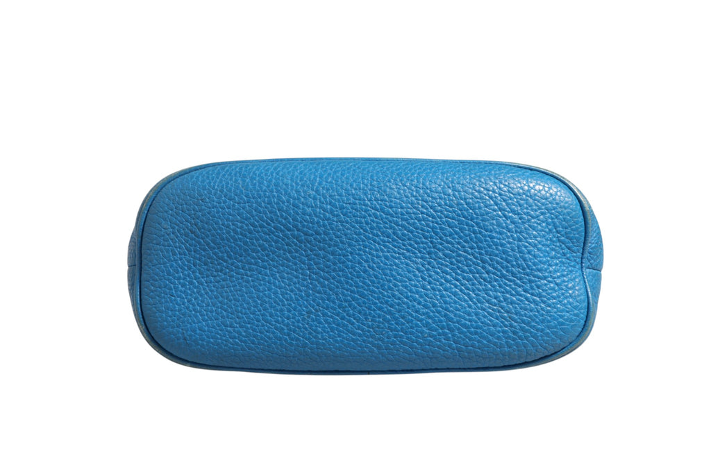 Sac à main en cuir bleu Gucci, forme arrondie avec poignée, design élégant et sophistiqué.
