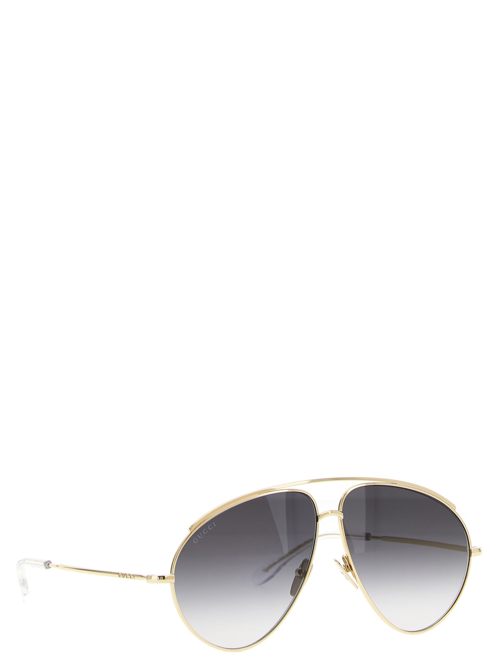 Lunettes de soleil Gucci en métal doré avec monture élégante et design moderne, vues de face.