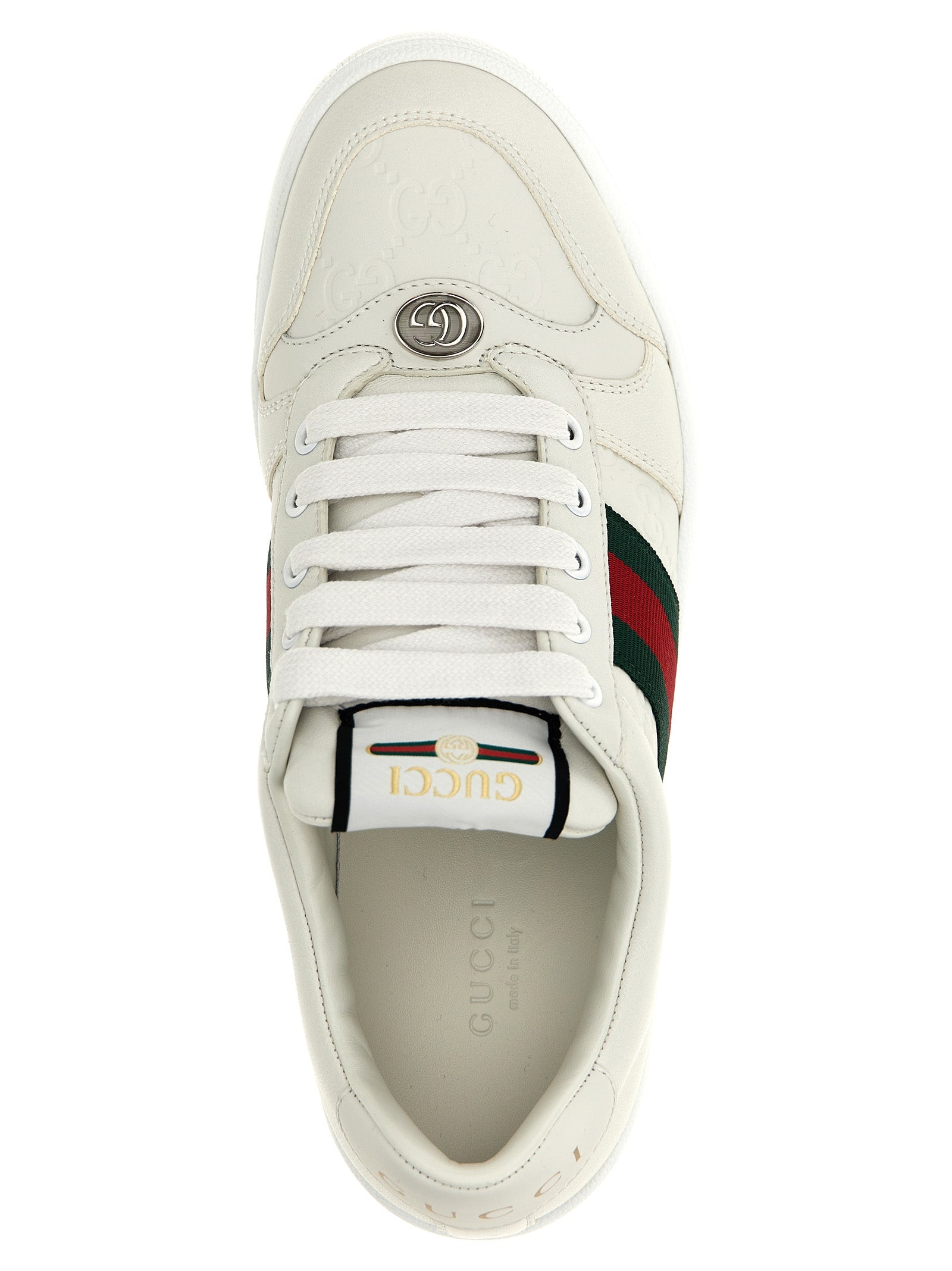 Baskets basses en cuir d'agneau blanc de Gucci, chaussures de sport élégantes avec logo sur le côté.
